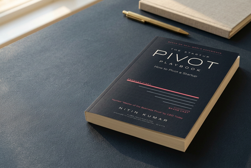 The Startup Pivot Playbook paperback by Nitin Kumar on a desk